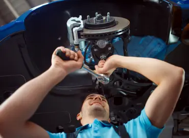 mechanic repairing mercedes benz suspension 